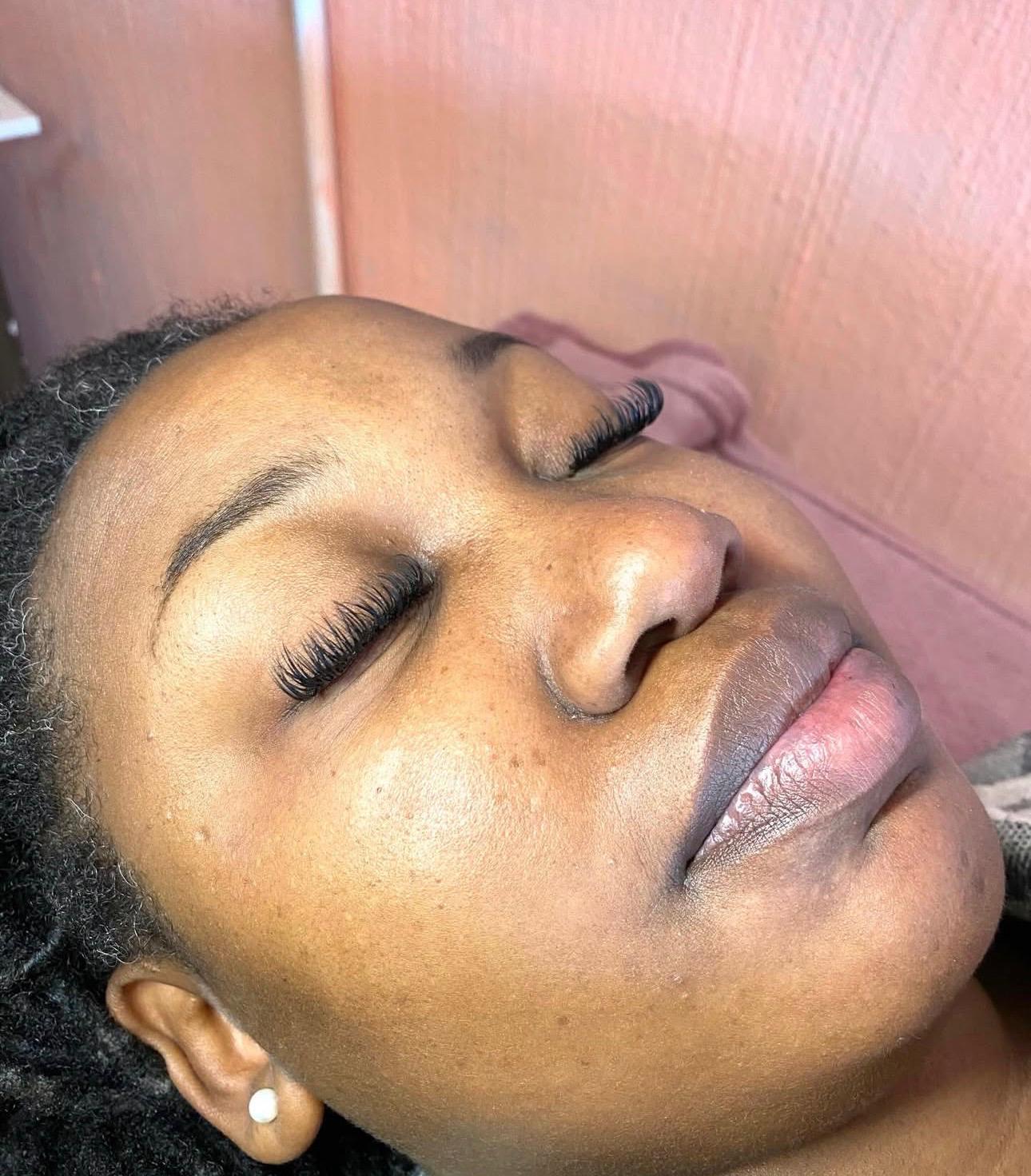 Client with glowing skin after a facial