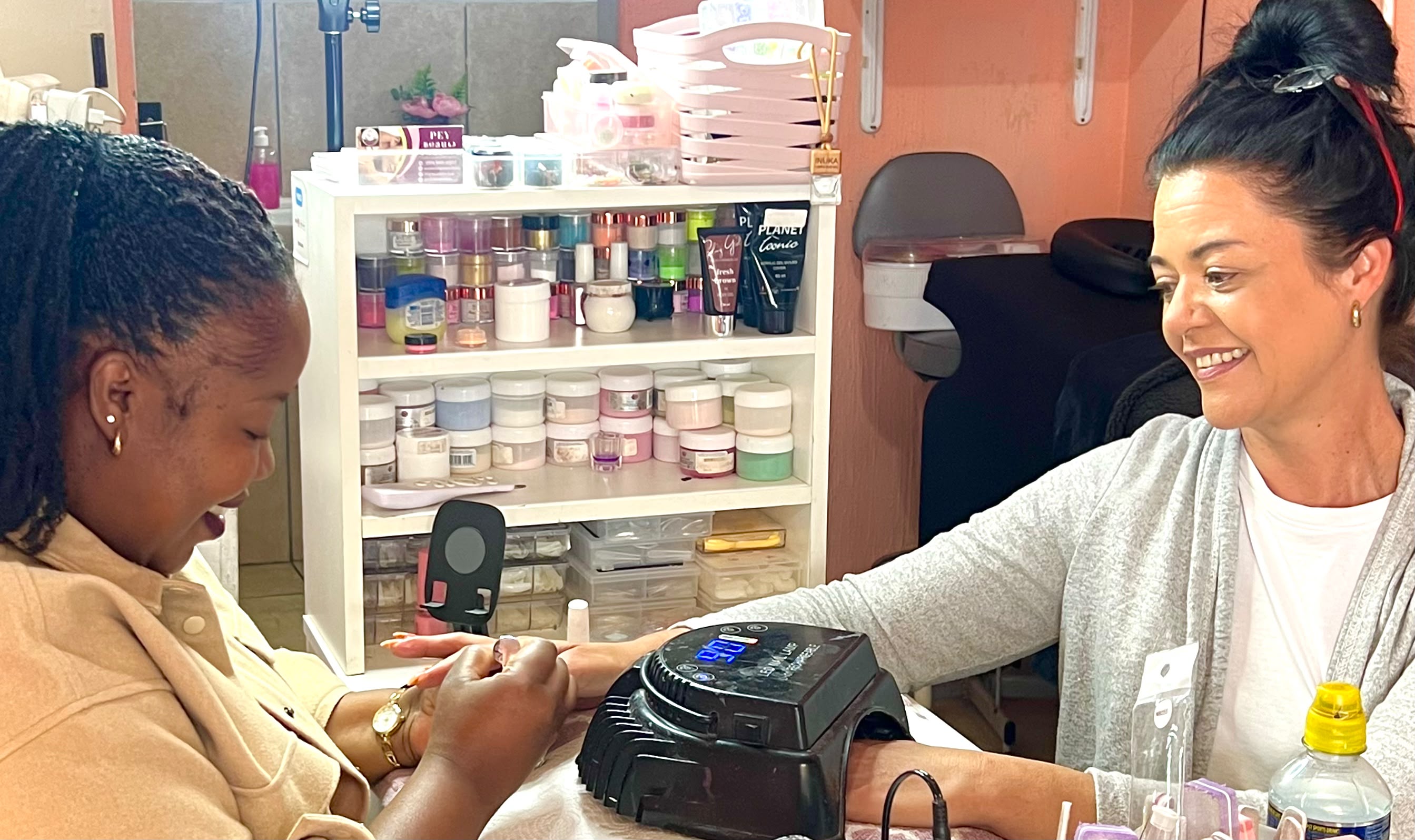 Therapist consulting with a client in the salon
